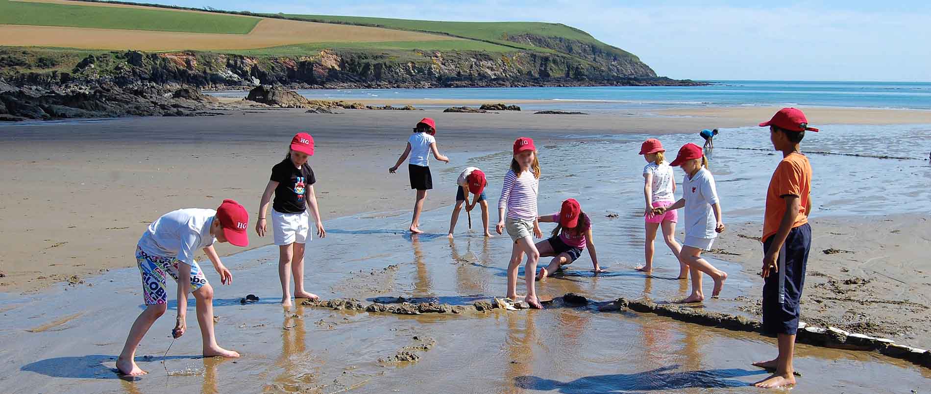 Children playing on the beach at Battisborough House