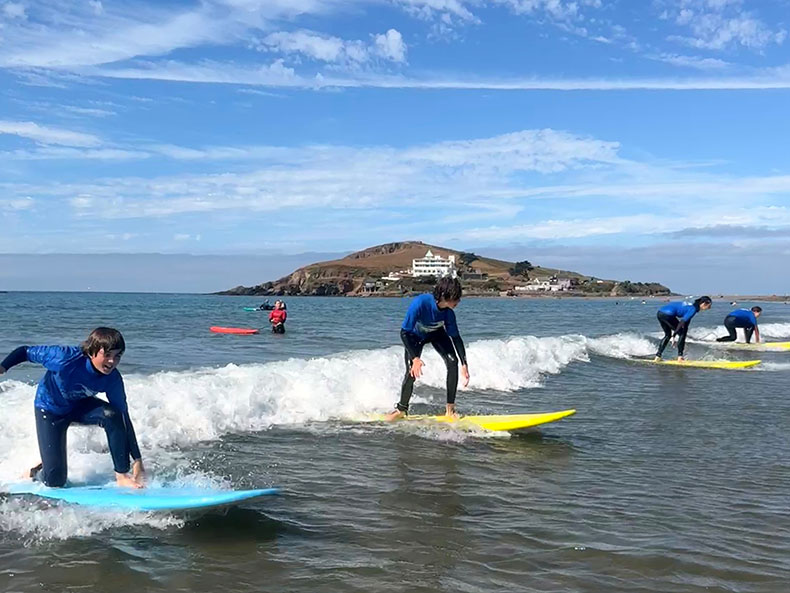 Children surfing at Discovery Surf School