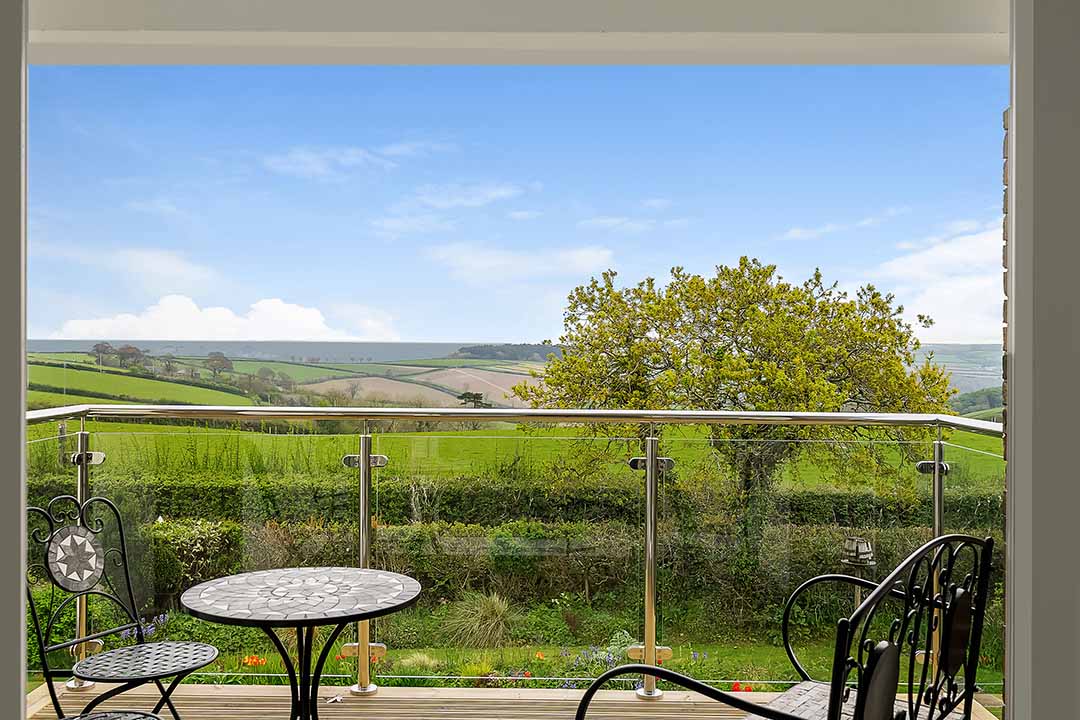 View from the balcony across the fields to the sea from The Lookout holiday house